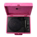 The inside of Arkrocket Curiosity Suitcase Bluetooth Turntable (Hot Pink Velvet) shows the circular turntable platter, stylus arm, and control buttons arranged neatly on a black panel