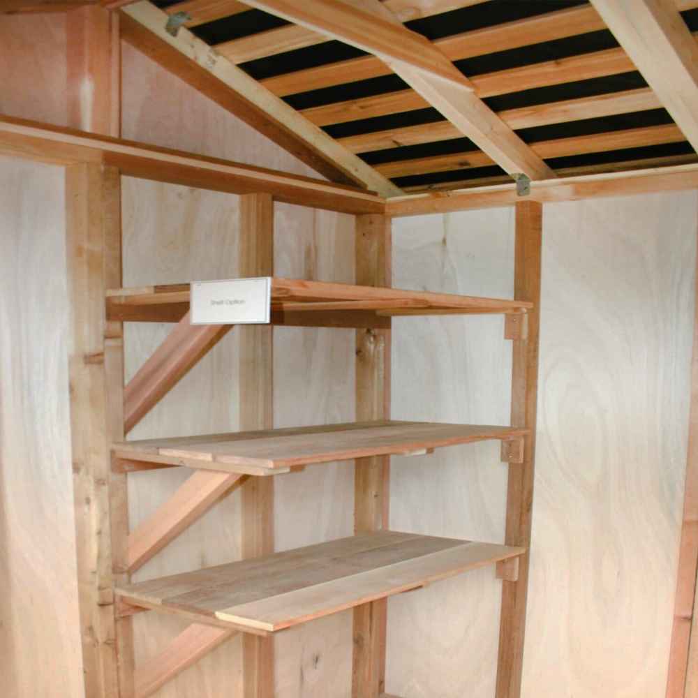 The inside of a shed showing wooden corner shelves under a sloped roof, demonstrating storage in the Outdoor Living Today 8×8 Gardener Shed