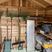 The inside of a wooden shed with shelves, garden tools, and storage bins organized along the walls of the Outdoor Living Today 8×8 Gardener Shed
