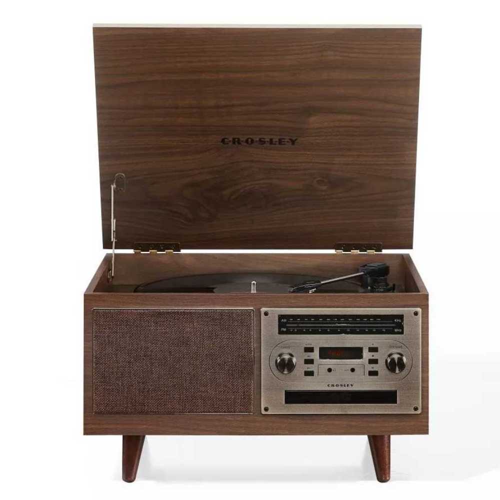 The lifted lid of the Crosley Serenade 8-In-1 Record Player - Walnut reveals the turntable, while its front panel includes a retro-style tuner, control knobs, and a cassette player