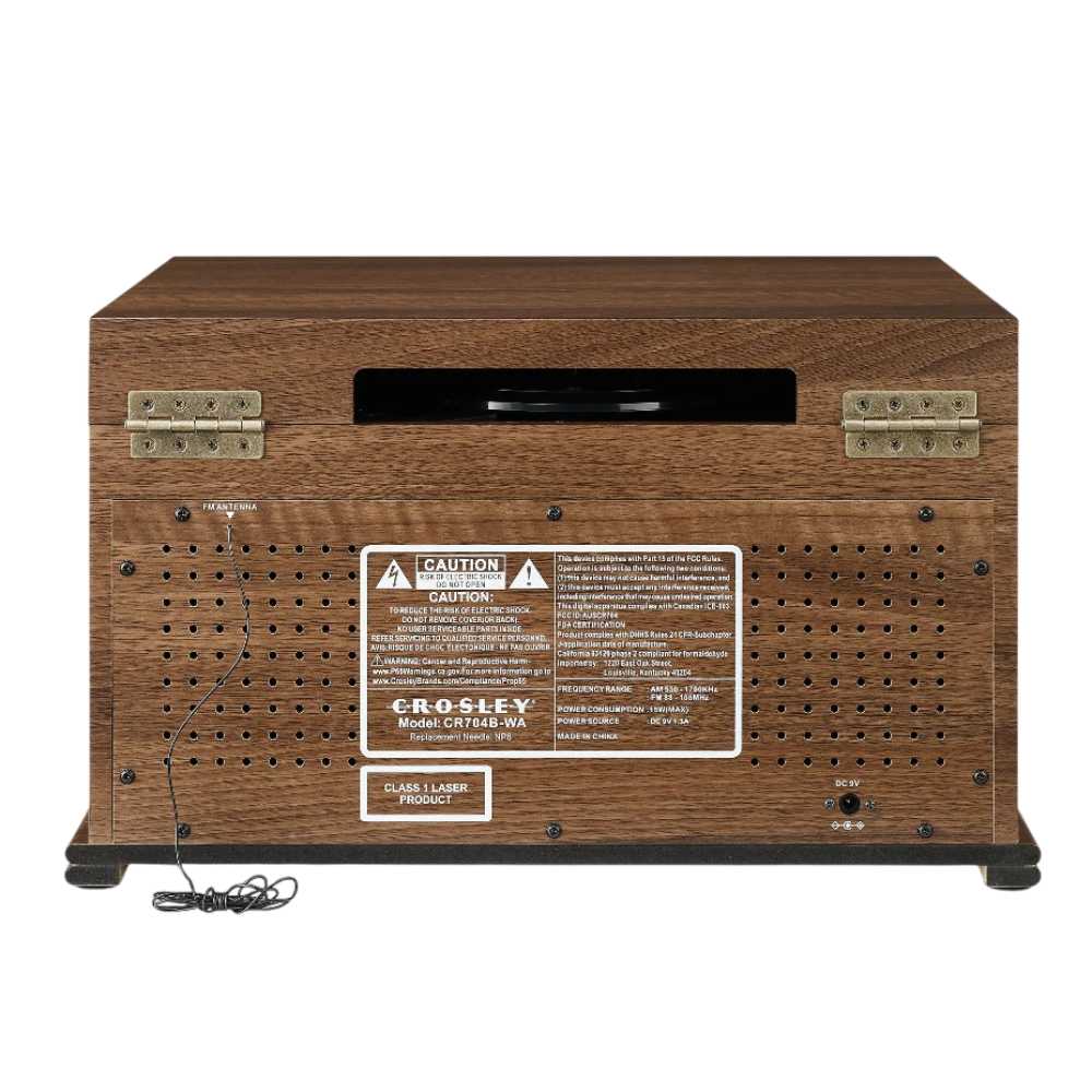 The rear view of the Crosley Musician Entertainment Center - Walnut reveals the CD player slot, caution labels, ventilation holes, and an attached power cord