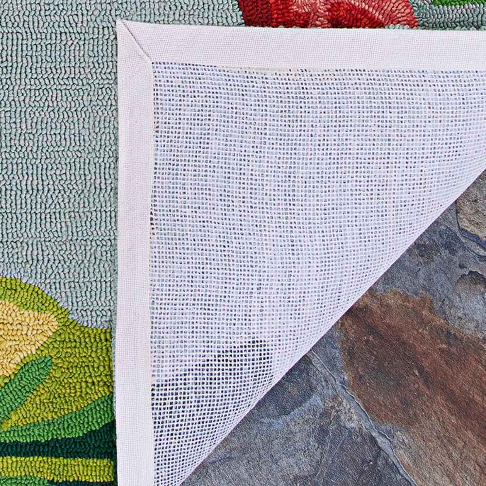 The reverse side of the Couristan Covington Indoor/Outdoor Rug - Flamingos/Multi includes a white mesh backing to help prevent slipping