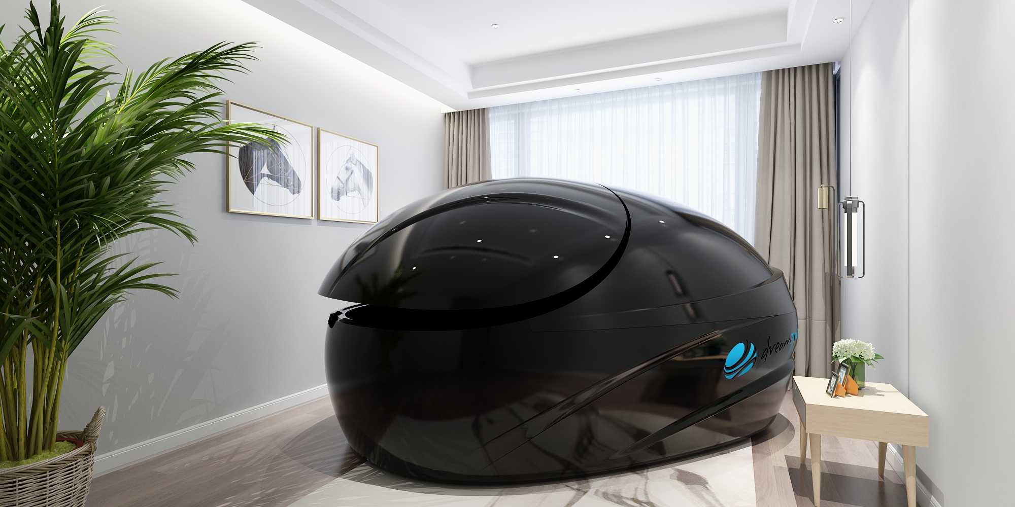 The sleek, black Dreampod Vmax Float Pod is set in a minimalist room with large windows and decorative plant