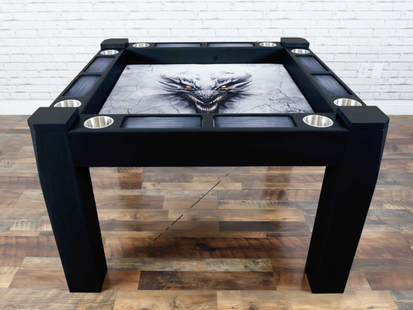 This Game Theory Tables Origins Modular Mini Game Table features a sleek black design and a fierce dragon image on the play surface