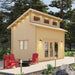 This corner view of Sawmill Structures The Versa 160 Atrium Loft 70MM Garden Room shows the cabin’s tall profile and inviting deck setup