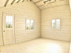 This empty wooden interior with pale planks and high ceilings highlights the raw space of a Sawmill Structures BlueWater Bungalow 160 Garden Room