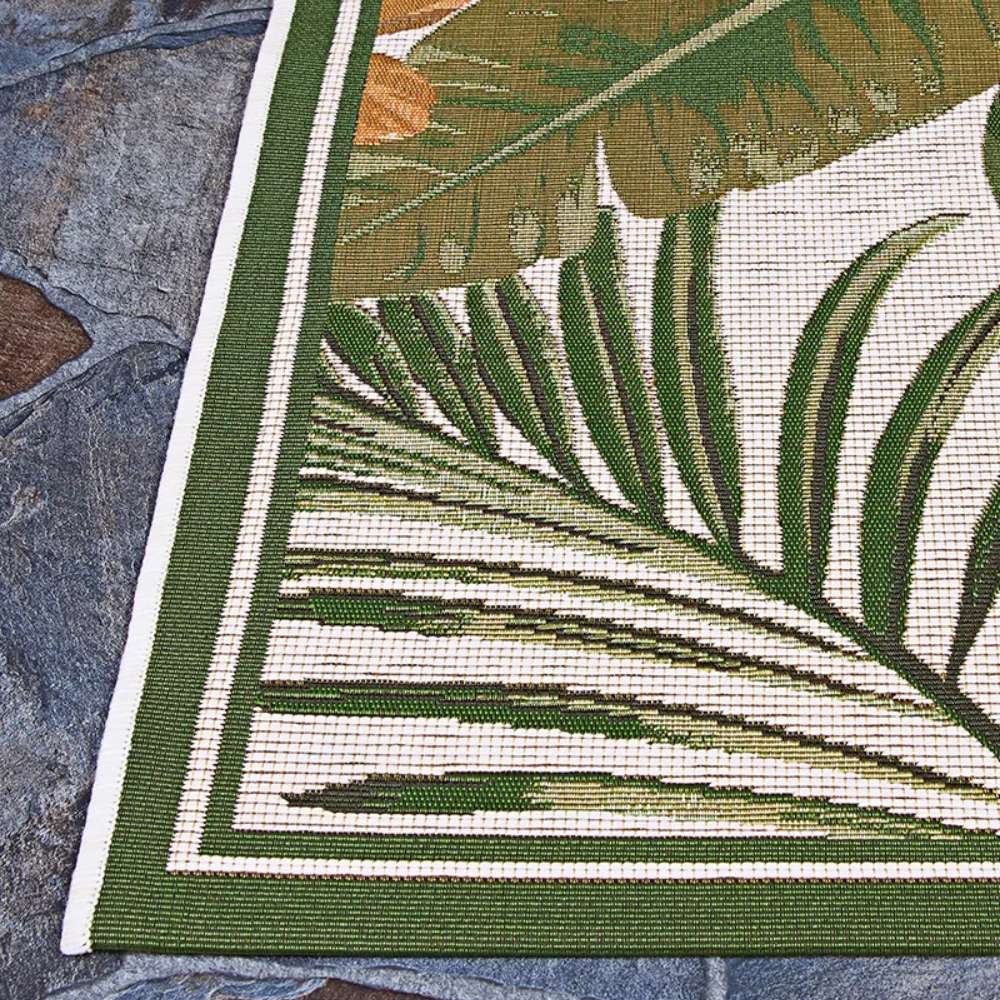 This image highlights the clean border and lush palm leaf design of Couristan Dolce Indoor/Outdoor Rug - Flowering Fern/Ivory-Hunter Green