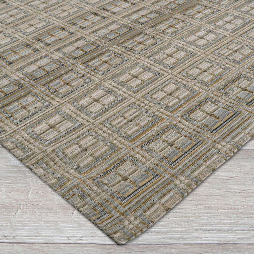 This side-angle view highlights the texture and geometric layout of Couristan Fez Indoor/Outdoor Rug - Sidi/Sunlight on a light wood floor