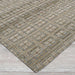 This side-angle view highlights the texture and geometric layout of Couristan Fez Indoor/Outdoor Rug - Sidi/Sunlight on a light wood floor
