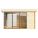 This side view shows the transparent glass facade of the GardenHouse24 USA ALU Concept 70M Garden Room, revealing its spacious, empty wooden interior