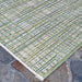 This angled view highlights the corner of the Couristan Cape Indoor/Outdoor Rug - Falmouth/Ivory-Hunter