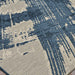 This angled view reveals the Couristan Castille Indoor/Outdoor Rug - Canvas/Orion’s brushstroke-inspired design and subtle texture
