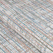 This close-up captures the intricate woven texture of the Couristan Cape Indoor/Outdoor Rug - Falmouth/Ivory-Coral with visible threads in ivory, coral, blue, and other colors