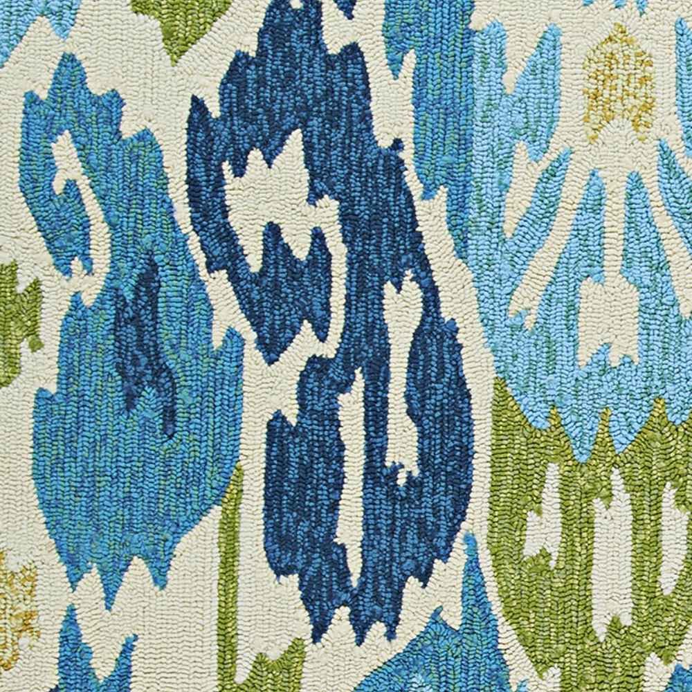 This detailed shot of the Couristan Covington Indoor/Outdoor Rug - Delfina/Azure-Lemon highlights its bold, colorful pattern with raised loops and vibrant contrast