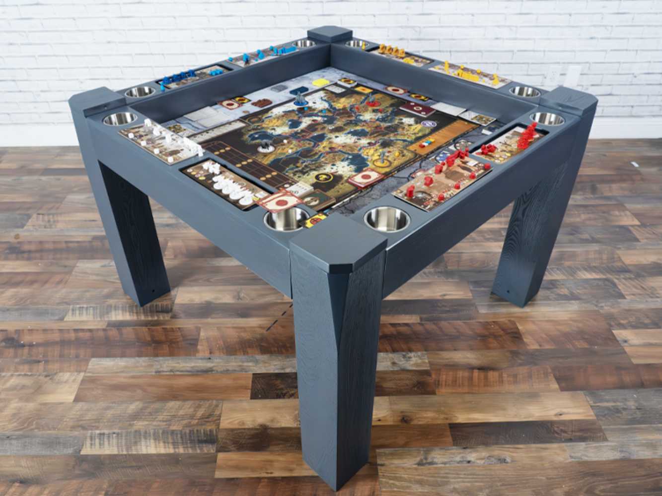 This gray Game Theory Tables Origins Modular Mini Game Table is fully equipped with game components organized around a large game board