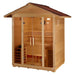 Three-quarter view of Golden Designs Vorarlberg 5 Person Traditional Outdoor Sauna showing a shingled gabled roof, glass double doors and lit benches inside