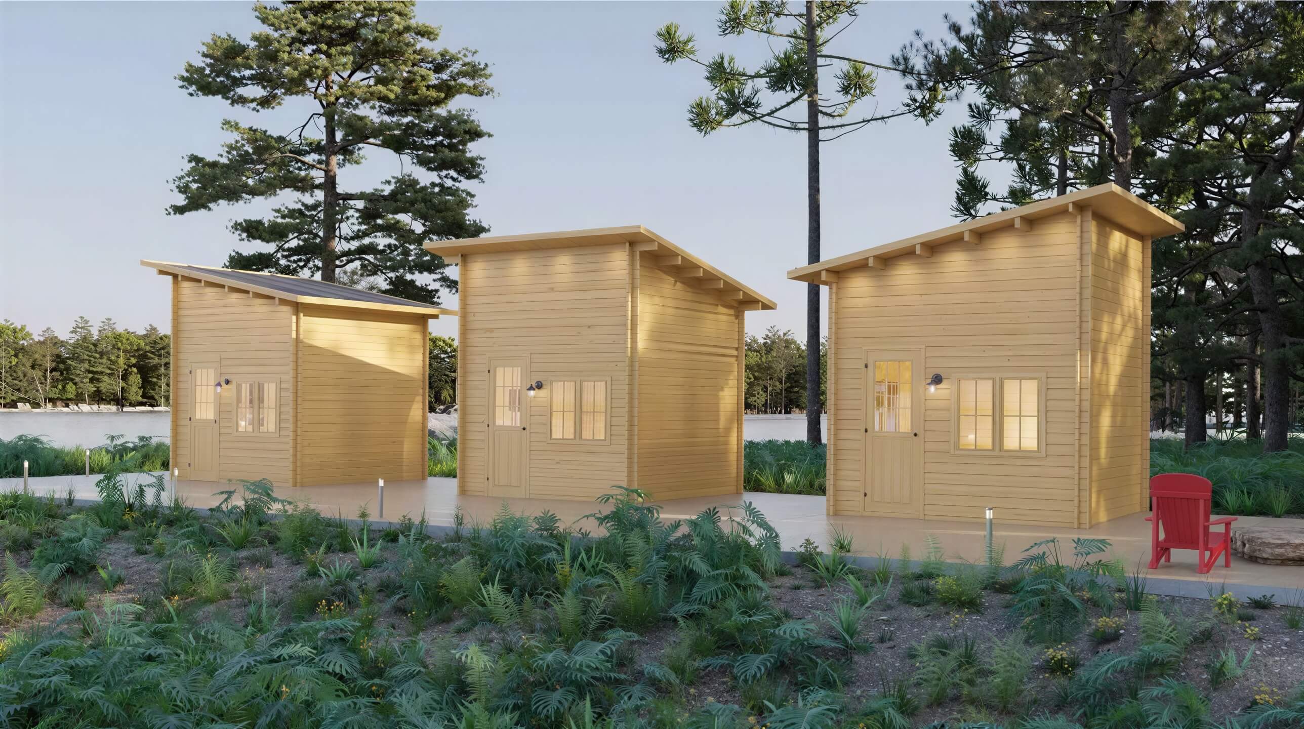 Three identical Sawmill Structures Cube Loft 100 Garden Room units line a forest path