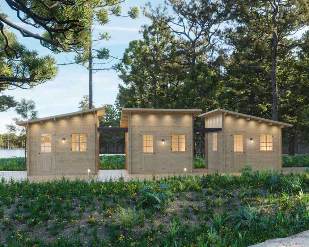 Three modular wooden cabins stand side-by-side, forming a connected retreat in the woods—this setup is part of the Sawmill Structures Multi Cube Versa 100 Garden Room system