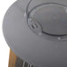 Top close-up of Westminster Teak Luna Large Lantern reveals a flat metal lid with a circular glass center and a small handle for carrying