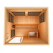 Top-down view inside Golden Designs Soria 3 Person Indoor Hybrid Sauna with Full Spectrum IR and Harvia Stove showing carbon panels on the walls, the bench and the floor layout