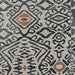 Top-down view of Couristan Dolce Indoor/Outdoor Rug - Mala/Smoke showcases its symmetrical pattern of diamonds and curved shapes in neutral tones with rust accents