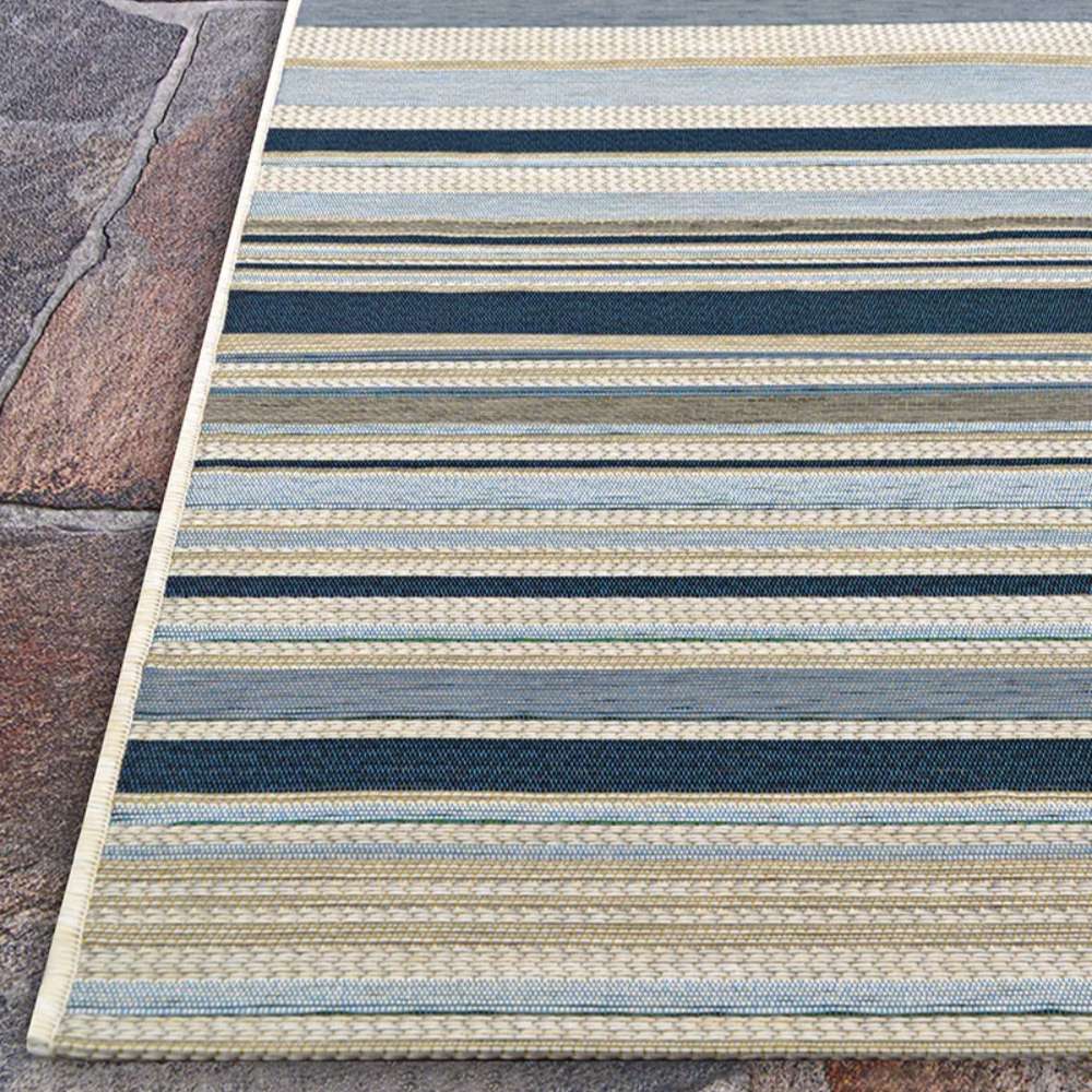 Top-down view of Couristan Dolce Indoor/Outdoor Rug - Striped/Nautical showcases its neat lines and rectangular shape on stone tiles.
