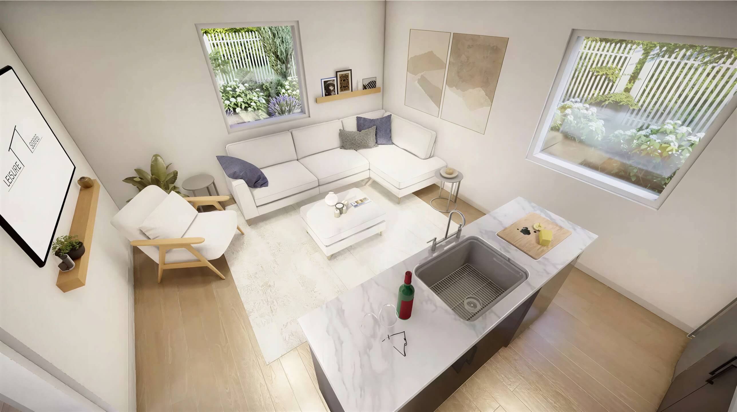 Top-down view of Sawmill Structures The Jasper Garden Suites shows a stylish open-concept living space with a marble island, couch, armchair, and large windows