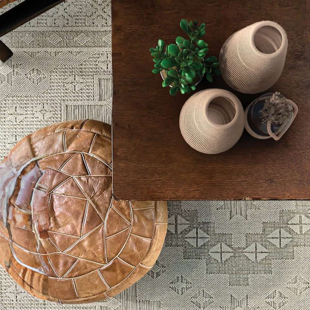 Top view of a styled living space with decor items placed on the Couristan Liguria Indoor/Outdoor Rug - Sarzana/Dove Grey