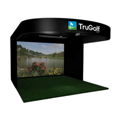 TruGolf Signature Golf Simulator shown as a black enclosed golf bay with a large projection screen displaying a realistic golf course and green turf flooring for indoor play