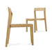 Two Westminster Teak Horizon Teak Side Chair pieces are displayed together, one facing sideways and the other angled, showing the chair’s clean lines and minimalist design