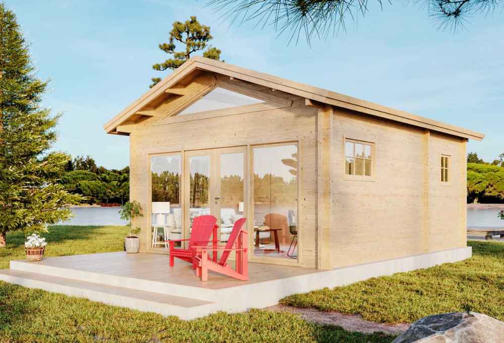 Two bright red chairs sit on the front porch of a cozy wood cabin beside a lake, showcasing the Sawmill Structures Edwin Lake House 70MM Garden Room