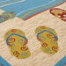 Two pairs of flip-flops in yellow and blue sit near a blue wave design on the Couristan Covington Indoor/Outdoor Rug - Sandals/Sand-Multi