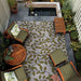 Underside of Couristan Dolce Indoor/Outdoor Rug - Summer Ivy/Ivory-Olive is flipped to show its brown backing with a faint mirrored leaf design