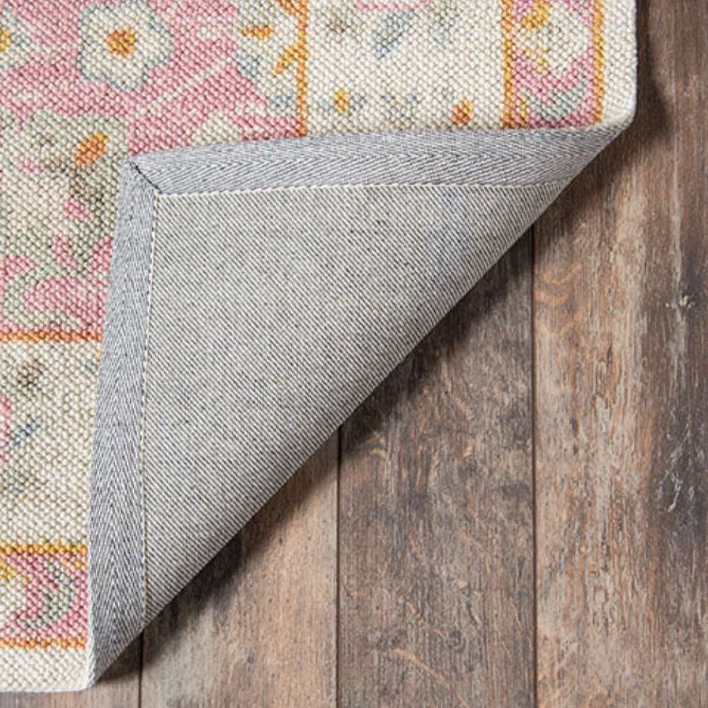 Underside of Momeni Anatolia Indoor Rug - ANA-8 Pink reveals a sturdy backing designed to keep the rug in place on hardwood floors