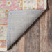 Underside of Momeni Anatolia Indoor Rug - ANA-8 Pink reveals a sturdy backing designed to keep the rug in place on hardwood floors