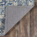 Underside of Momeni Anatolia Indoor Rug - ANA-9 Blue reveals a sturdy backing that helps keep it in place on hardwood floors