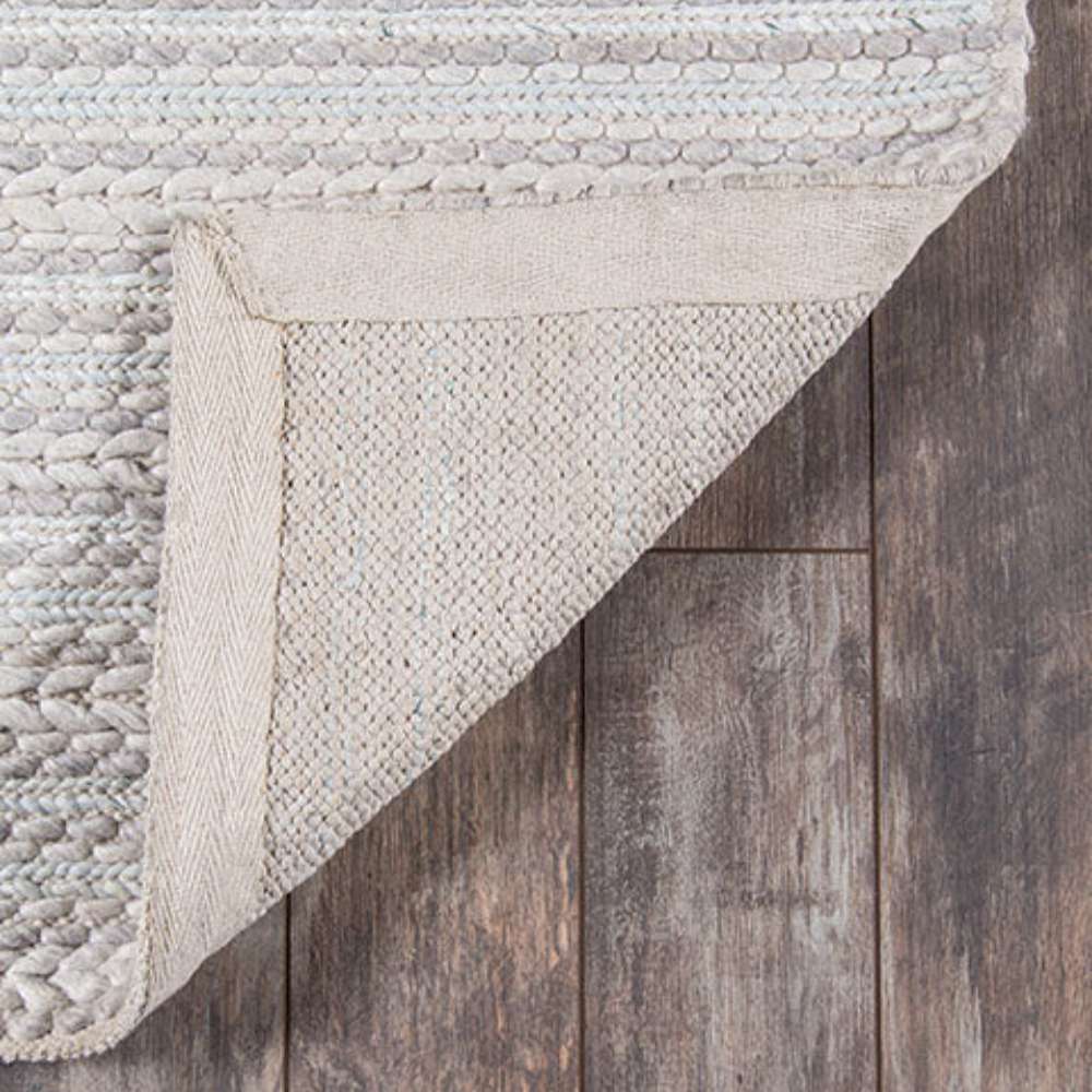 Underside of Momeni Andes Indoor Rug - AND-4 Light Grey shows its sturdy backing