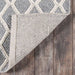 Underside of Momeni Andes Indoor Rug - AND-7 Grey reveals a sturdy backing that keeps the rug in place on hardwood floors