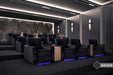 Valencia Naples Prestige Home Theater Seating is arranged in a private cinema room, featuring multiple rows of plush, black reclining chairs