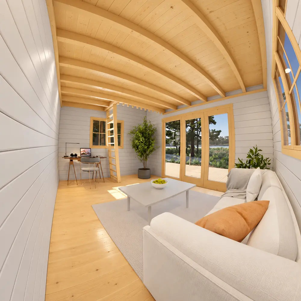 Alternate view of the Versa 160 Atrium Loft 70MM interior showing a white sofa, orange pillow, desk, loft ladder, plants, and glazed garden doors.