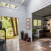 Versa 240 70MM interior combining a forest-facing fitness area with an adjoining home office featuring a desk, chair, shelving, plants, and exercise accessories.