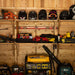 Well-organized shed wall features Outdoor Living Today 8ft Western Red Cedar Shed Shelves (Set of 3) storing helmets, tools, and equipment