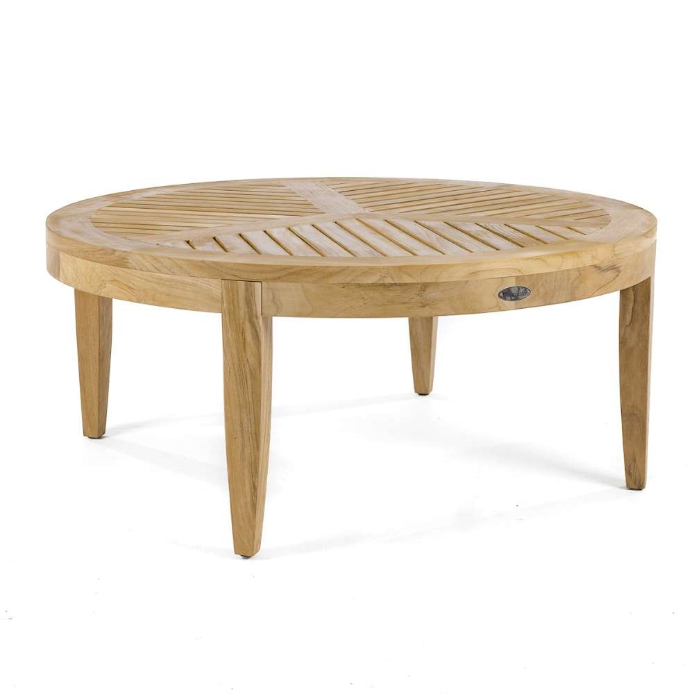 Westminster Teak 6pc Laguna Lounge Seating Set includes a round teak coffee table with a slatted top and four straight legs on a plain background