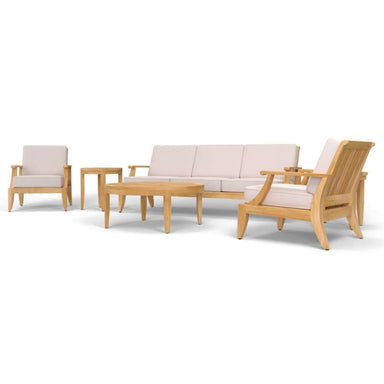 Westminster Teak 6pc Laguna Lounge Seating Set is shown from a slight angle displaying the full arrangement of sofa, chairs, and round tables with light cushions and teak frames