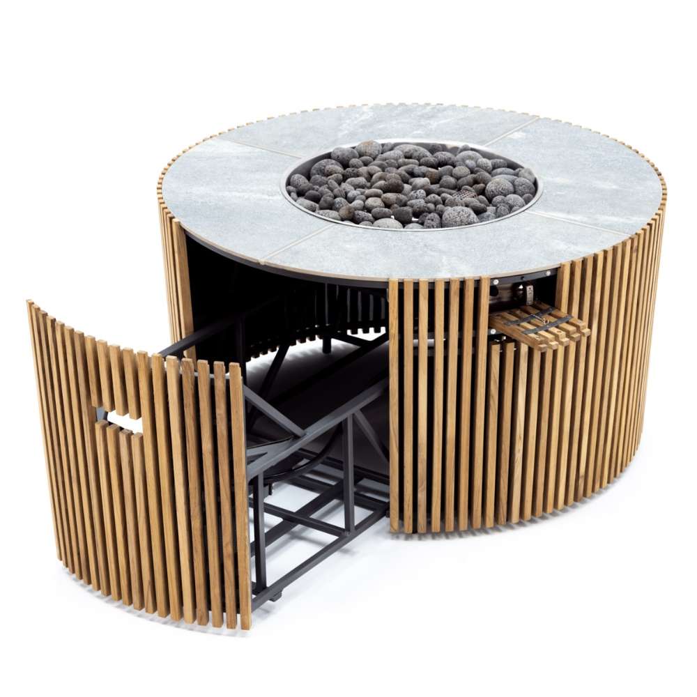 Westminster Teak Agora Fire Table shows its hidden propane tank storage compartment opened beneath the round fire bowl