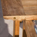 Westminster Teak Horizon 11pc Teak Dining Set in a close-up of the teak table corner, highlighting the extension leaf connection and metal hardware