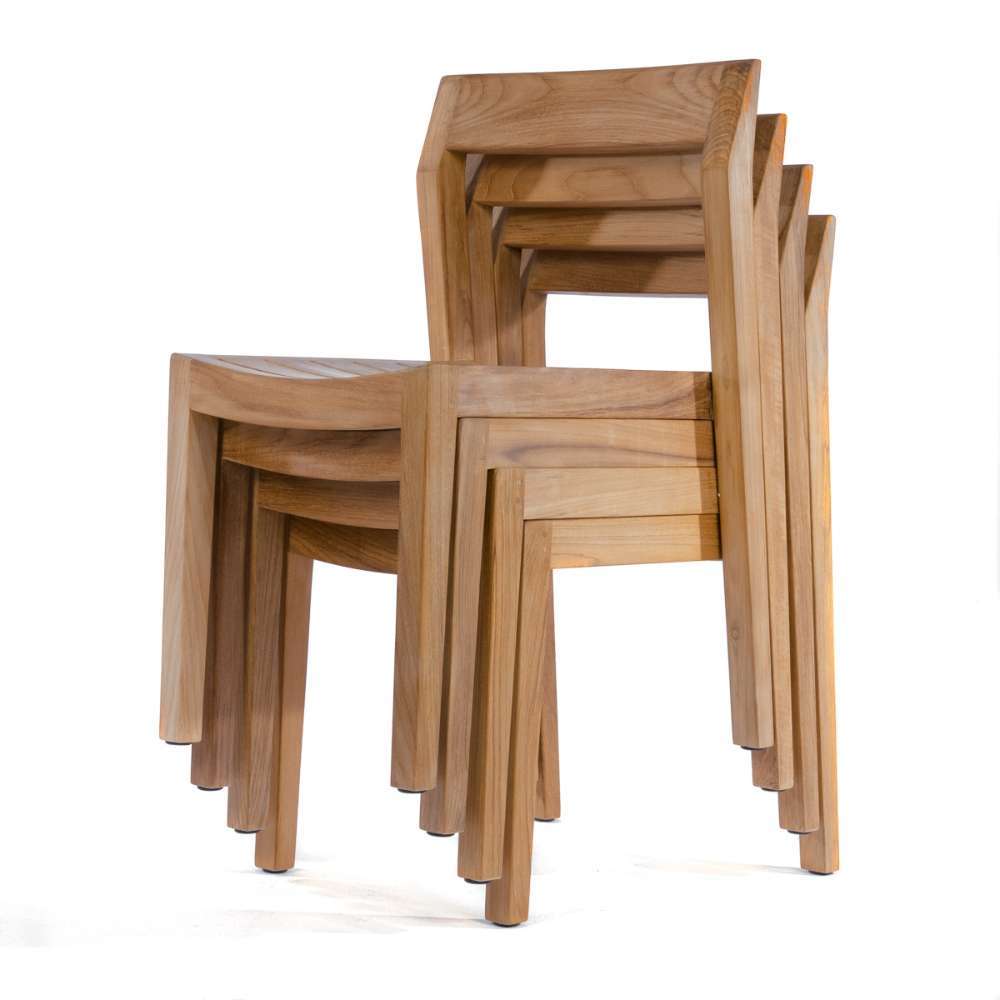 Westminster Teak Horizon 11pc Teak Dining Set is shown with several teak armchairs stacked together
