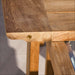Westminster Teak Horizon 9pcs Teak Dining Set close-up detail of the table corner showing smooth teak wood grain and a rounded edge with a small metal fitting