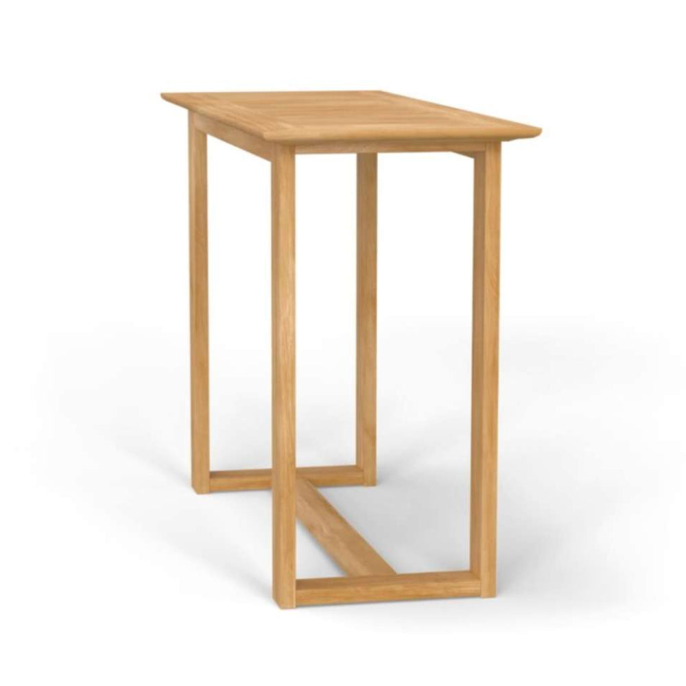 Westminster Teak Horizon Teak Bar Table is viewed at an angle, showing its rectangular surface and strong frame with a horizontal support beam near the base