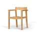 Westminster Teak Horizon Teak Dining Armchair is shown at an angle, featuring a smooth wooden frame, curved seat, and sturdy armrests on a clean white background